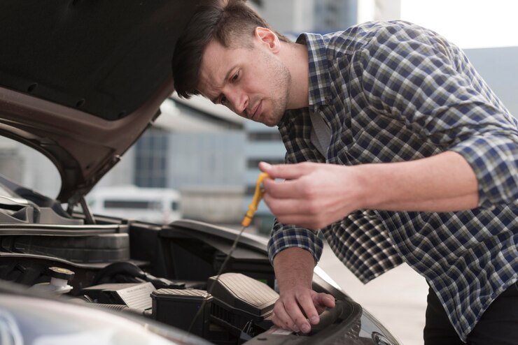 low-angle-man-fixing-car_23-2148514924 - Copy